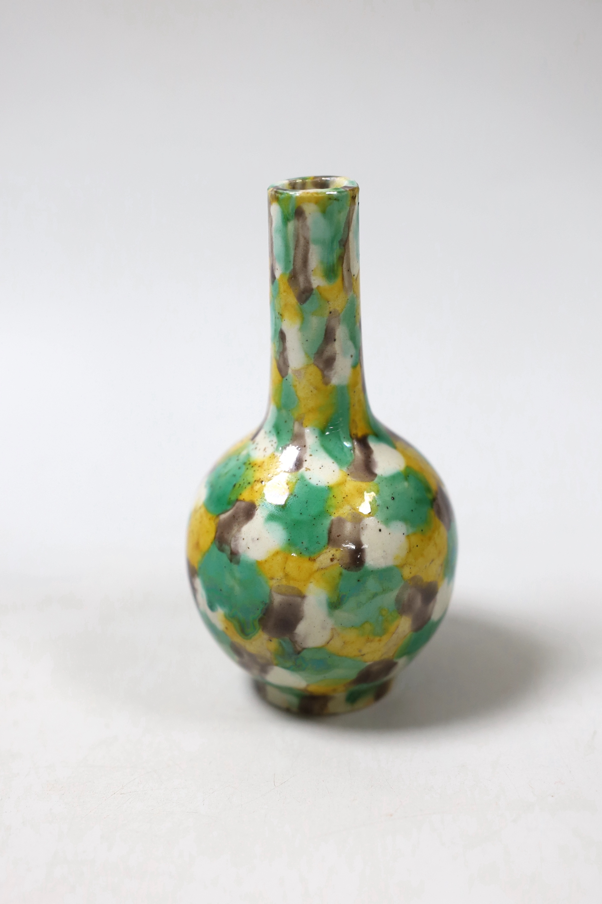 A small Chinese polychrome bottle vase, 13.5cm high